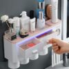 Toothpaste dispenser with toothbrush holder